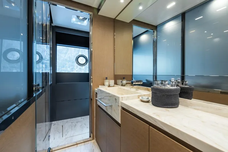 Kar Yacht Photos Pics Luxurious bathroom interior on 2021 Riva 88 Folgore yacht with modern fixtures and elegant design.