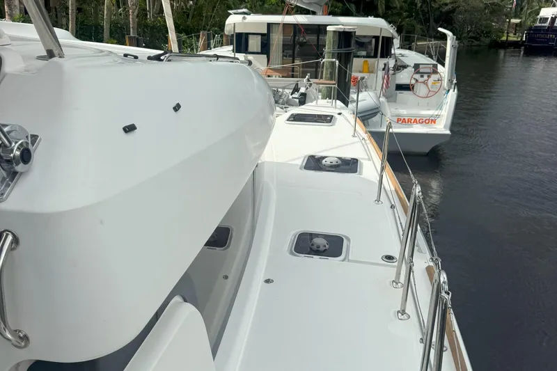 Keola Yacht Photos Pics 2022 Lagoon 40 catamaran docked, showcasing sleek deck design and modern features.