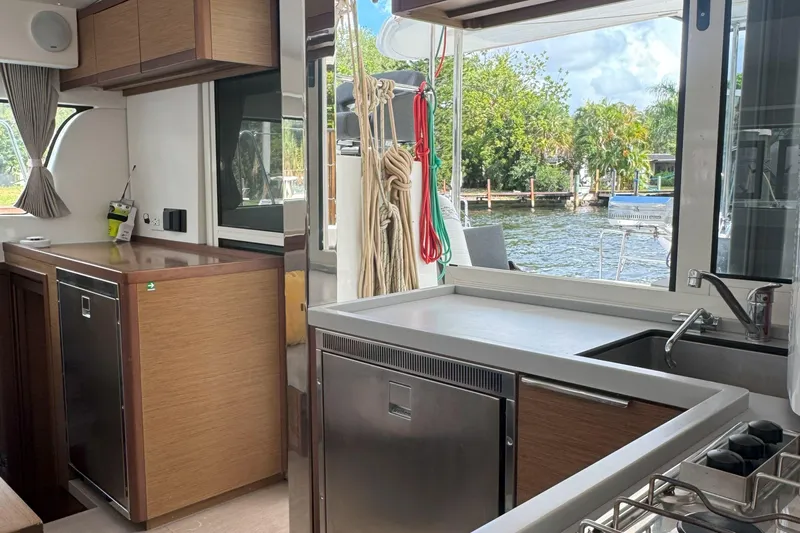 Keola Yacht Photos Pics Modern kitchen interior of 2022 Lagoon 40 catamaran with outdoor view.