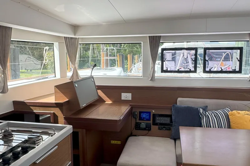 Keola Yacht Photos Pics Interior of 2022 Lagoon 40 catamaran with modern kitchen and seating area.