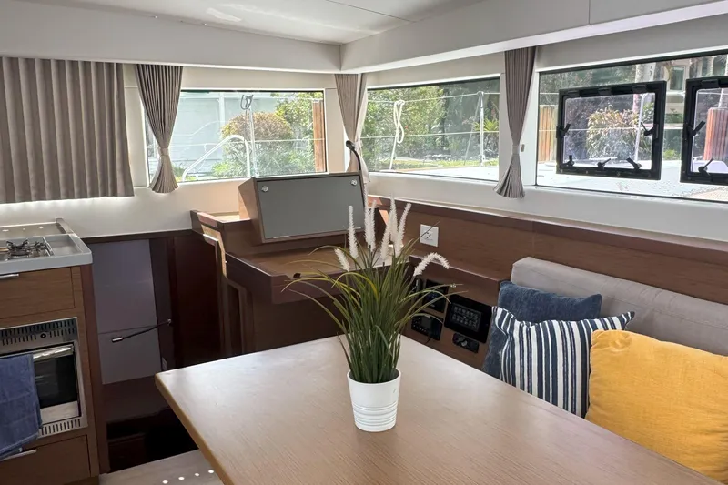 Keola Yacht Photos Pics Interior of 2022 Lagoon 40 yacht with modern decor and large windows.