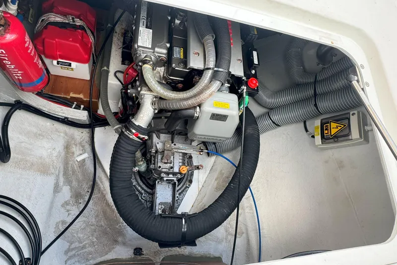 Keola Yacht Photos Pics Engine compartment of a 2022 Lagoon 40 catamaran with visible components and fire extinguisher.