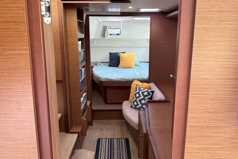 Keola Yacht Photos Pics Interior of 2022 Lagoon 40 yacht with cozy bedroom and stylish wooden finish.