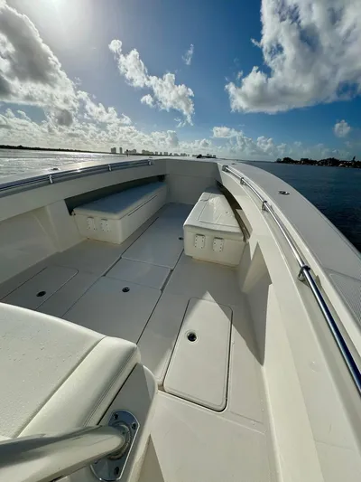 Cheers Yacht Photos Pics 2020 Invincible 33 Open Fisherman boat deck under a bright blue sky.