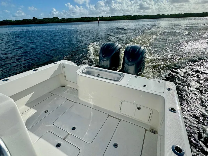 Cheers Yacht Photos Pics 2020 Invincible 33 Open Fisherman boat on water, featuring dual outboard motors.