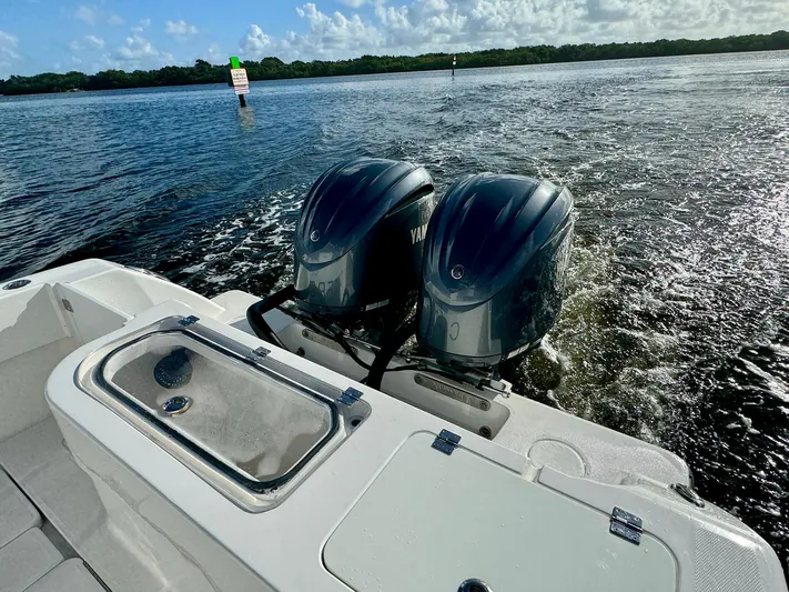 Cheers Yacht Photos Pics 2020 Invincible 33 Open Fisherman boat with dual Yamaha engines on water.