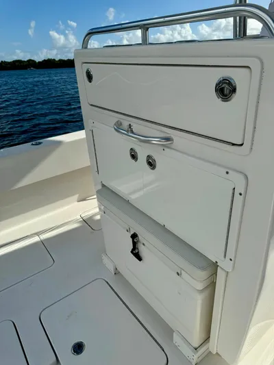 Cheers Yacht Photos Pics 2020 Invincible 33 Open Fisherman boat interior with storage compartments.