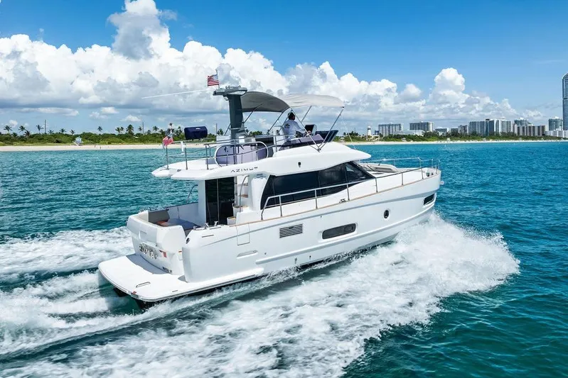  Yacht Photos Pics Azimut Magellano 43 yacht cruising in clear blue waters, 2021 model.