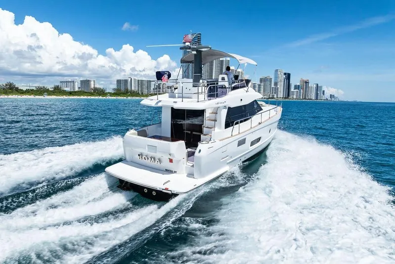  Yacht Photos Pics Azimut Magellano 43 yacht cruising near city skyline, 2021 model.