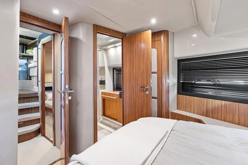  Yacht Photos Pics Luxurious interior of 2021 Azimut Magellano 43 yacht with wood finishes and modern design.