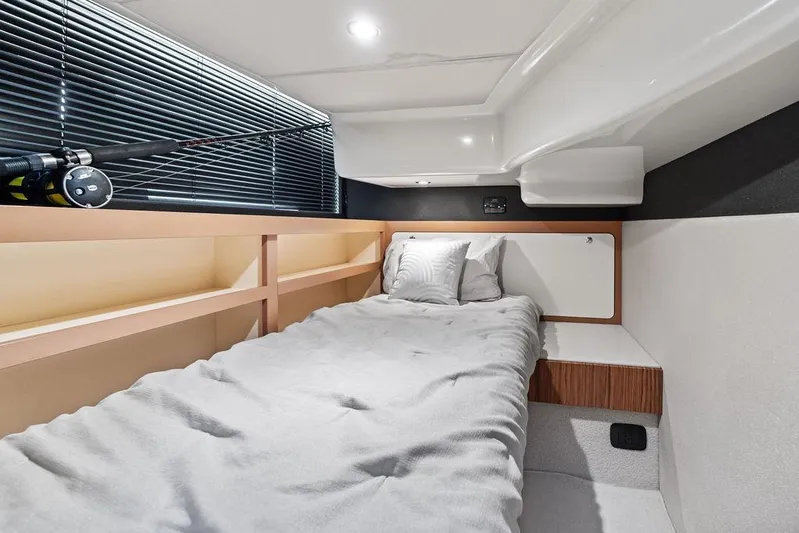  Yacht Photos Pics Interior cabin of 2021 Azimut Magellano 43 yacht, featuring a cozy bed and modern design.