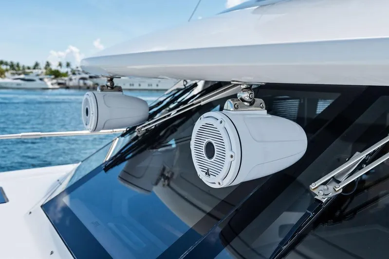  Yacht Photos Pics Azimut Magellano 43 yacht speakers, 2021 model, with ocean and boats in background.