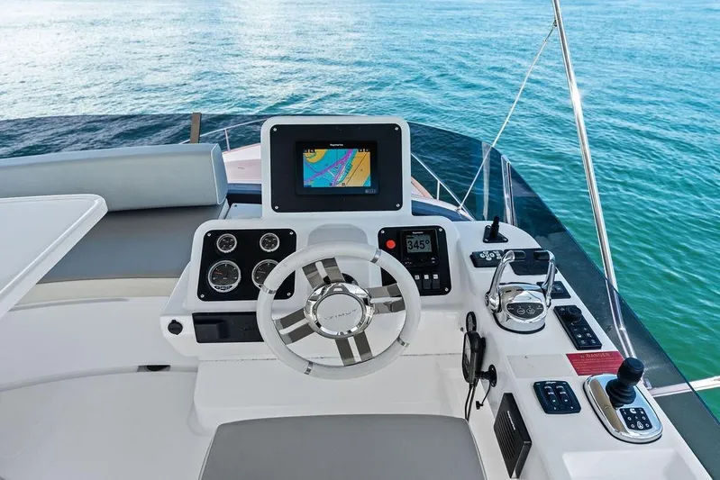  Yacht Photos Pics Helm of 2021 Azimut Magellano 43 yacht with navigation controls and sea view.
