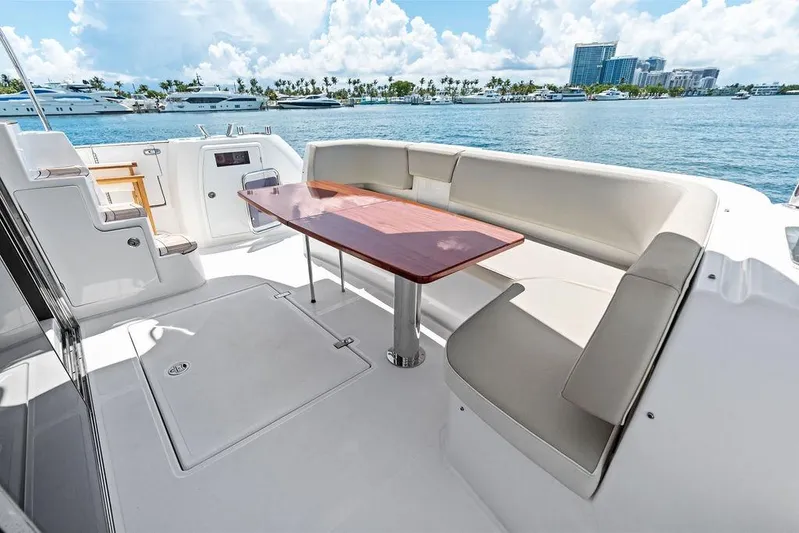  Yacht Photos Pics Azimut Magellano 43 yacht deck with seating and table, 2021 model, ocean view.