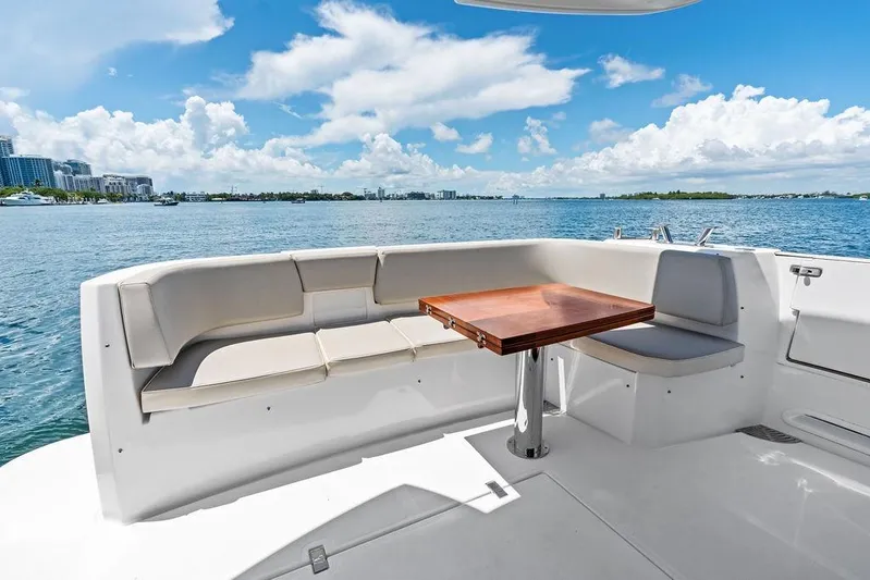  Yacht Photos Pics Azimut Magellano 43 yacht deck with seating and table, ocean view, 2021 model.