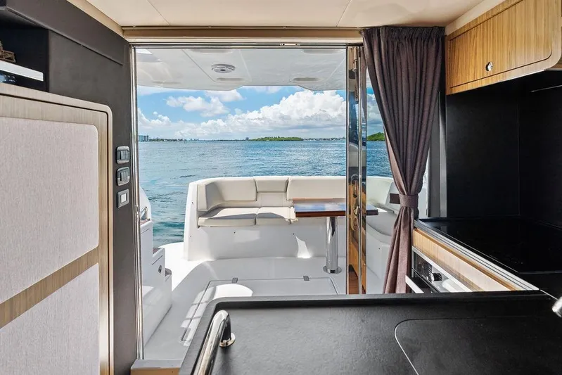  Yacht Photos Pics Interior view of 2021 Azimut Magellano 43 yacht with ocean backdrop.