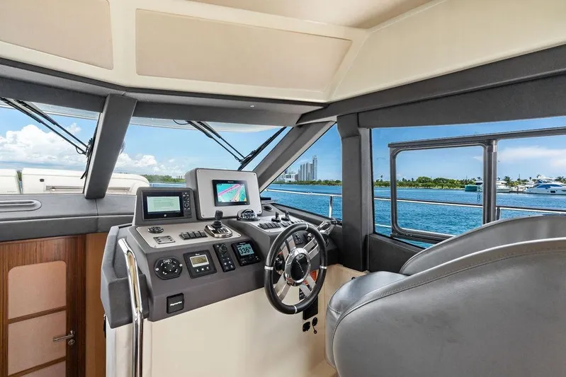  Yacht Photos Pics Helm of 2021 Azimut Magellano 43 yacht with navigation equipment and ocean view.