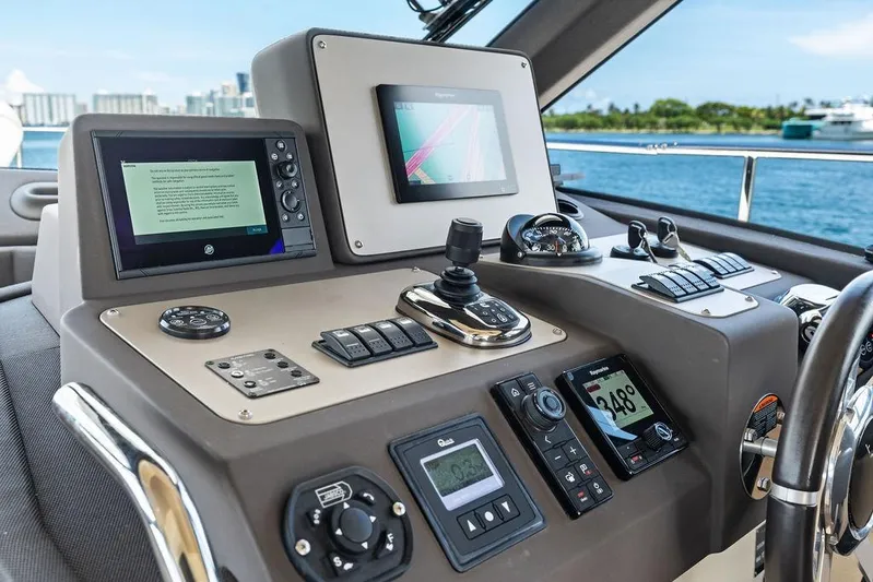  Yacht Photos Pics Control panel of 2021 Azimut Magellano 43 yacht with navigation screens and controls.