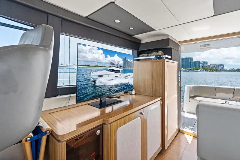  Yacht Photos Pics Interior of 2021 Azimut Magellano 43 yacht with TV and waterfront view.