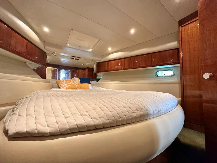  Yacht Photos Pics Luxurious cabin interior of a 1997 Azimut 43 yacht with cozy bedding.
