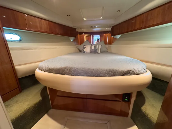  Yacht Photos Pics Luxurious cabin interior of a 1997 Azimut 43 yacht with a round bed.