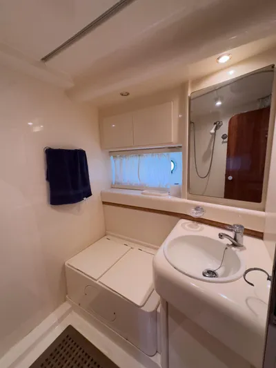  Yacht Photos Pics Bathroom interior of a 1997 Azimut 43 yacht, featuring sink and shower.