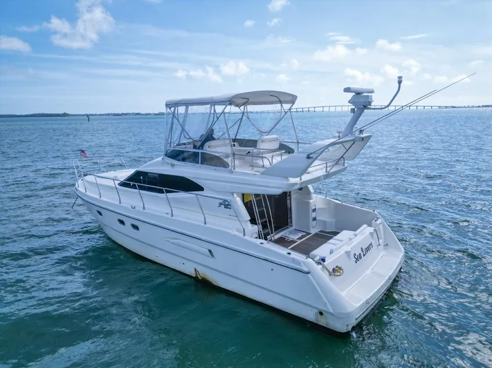  Yacht Photos Pics 1997 Azimut 43 yacht on open water under clear blue sky.