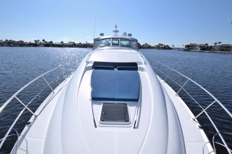 You, Me And The Sea Yacht Photos Pics 2003 Sea Ray 480 Motor Yacht on calm water, sunny day, luxurious deck view.