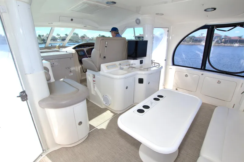 You, Me And The Sea Yacht Photos Pics Interior of 2003 Sea Ray 480 Motor Yacht with seating and helm, overlooking water.