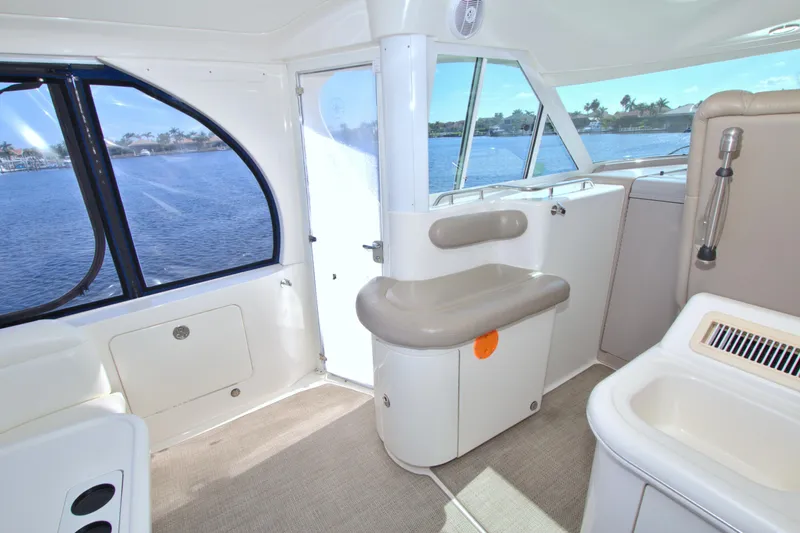 You, Me And The Sea Yacht Photos Pics Interior of 2003 Sea Ray 480 Motor Yacht with seating and windows overlooking water.
