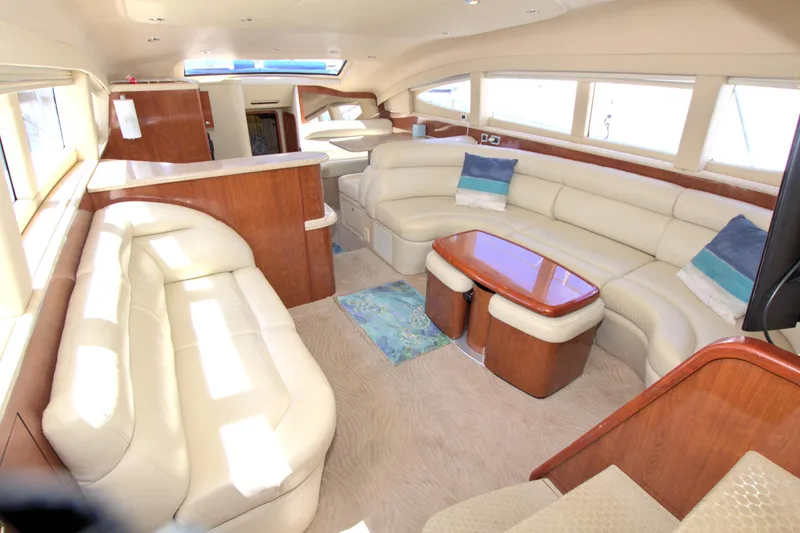 You, Me And The Sea Yacht Photos Pics Luxurious interior of 2003 Sea Ray 480 Motor Yacht with plush seating and elegant wood finishes.