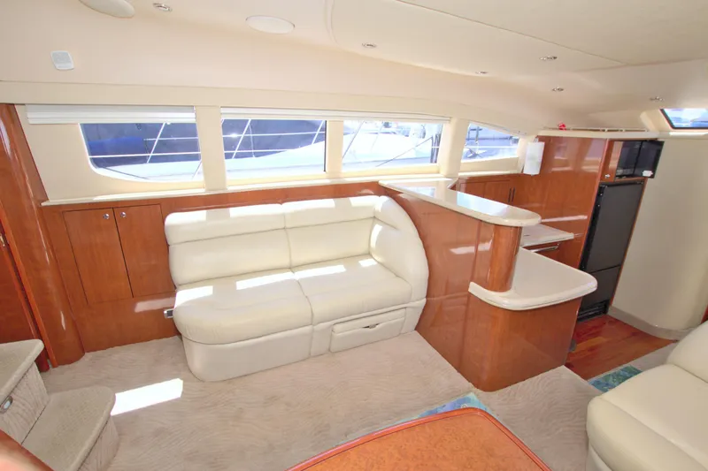You, Me And The Sea Yacht Photos Pics Luxurious interior of 2003 Sea Ray 480 Motor Yacht with plush seating and elegant wood finishes.