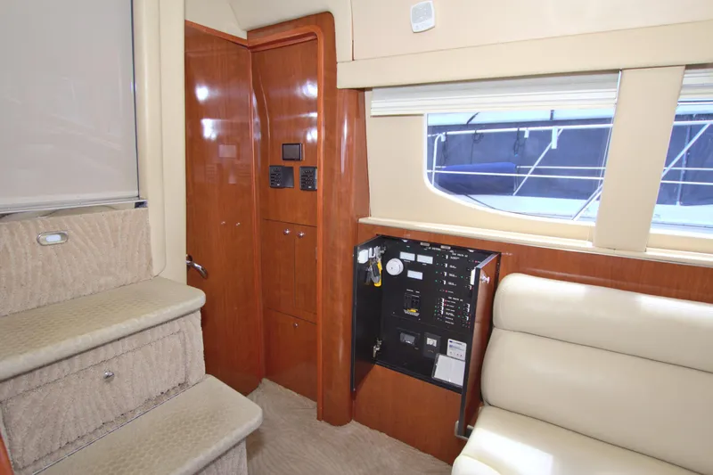 You, Me And The Sea Yacht Photos Pics Interior of 2003 Sea Ray 480 Motor Yacht with control panel and seating area.