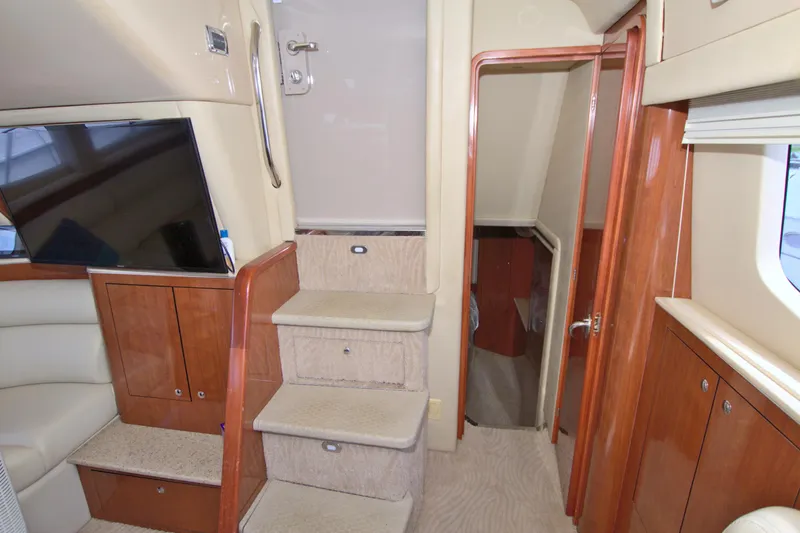 You, Me And The Sea Yacht Photos Pics Interior of 2003 Sea Ray 480 Motor Yacht with stairs and wooden cabinetry.