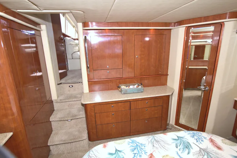 You, Me And The Sea Yacht Photos Pics Interior of 2003 Sea Ray 480 Motor Yacht with wooden cabinetry and carpeted stairs.