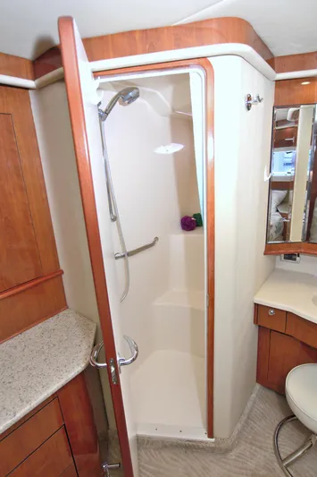 You, Me And The Sea Yacht Photos Pics Shower area in 2003 Sea Ray 480 Motor Yacht with wooden cabinetry and modern fixtures.
