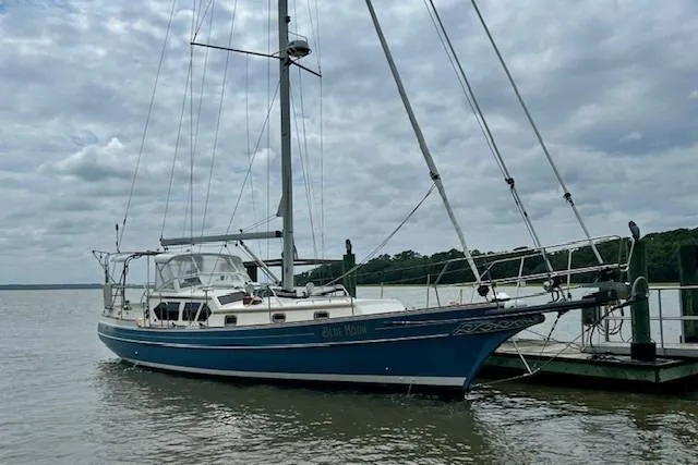 Blue Moon Yacht Photos Pics 2016 Gozzard 41 RC sailboat docked on a cloudy day.