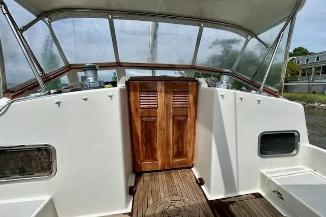 Blue Moon Yacht Photos Pics Cockpit of 2016 Gozzard 41 RC sailboat with wooden doors and teak flooring.