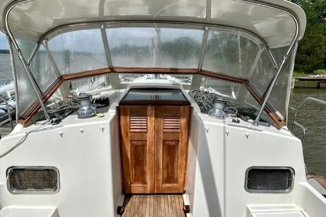 Blue Moon Yacht Photos Pics 2016 Gozzard 41 RC yacht cockpit with wooden doors and protective canopy.