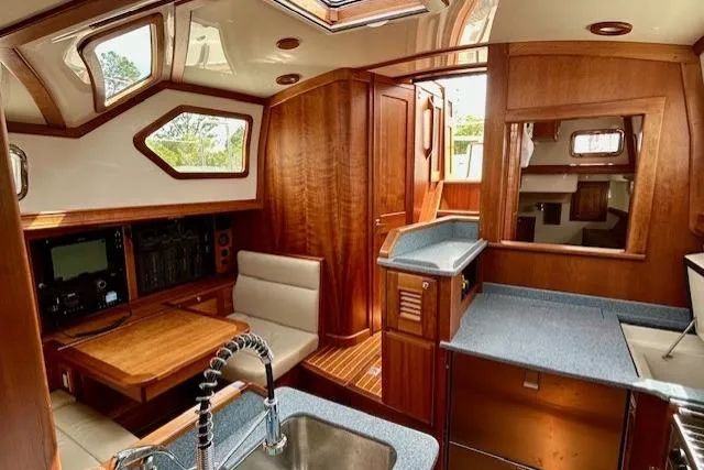 Blue Moon Yacht Photos Pics Luxurious interior of 2016 Gozzard 41 RC yacht with wood finish and modern amenities.