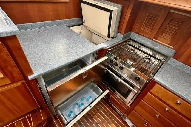 Blue Moon Yacht Photos Pics Gozzard 41 RC 2016 yacht kitchen with stove, fridge, and freezer.