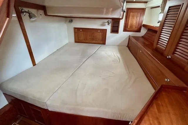 Blue Moon Yacht Photos Pics Cozy cabin interior of 2016 Gozzard 41 RC sailboat with wooden furnishings.