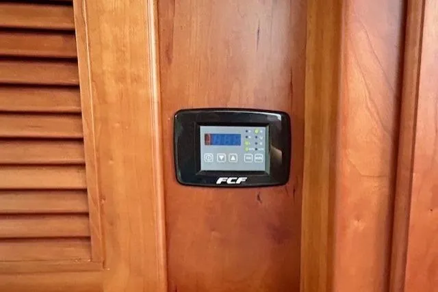Blue Moon Yacht Photos Pics Control panel on 2016 Gozzard 41 RC yacht, mounted on wooden interior.