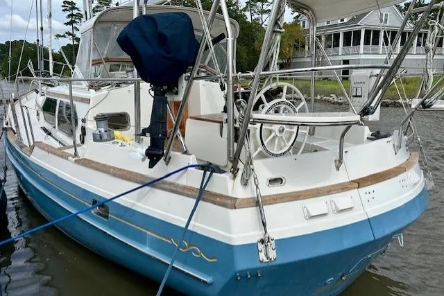 Blue Moon Yacht Photos Pics 2016 Gozzard 41 RC sailboat docked, featuring blue hull and white deck.