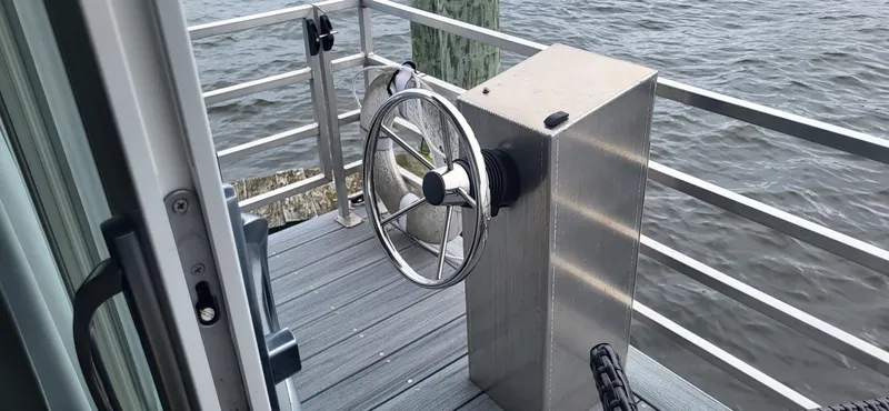  Yacht Photos Pics Steering wheel on 2020 Destination Yachts 16x45 Condo Series houseboat deck.