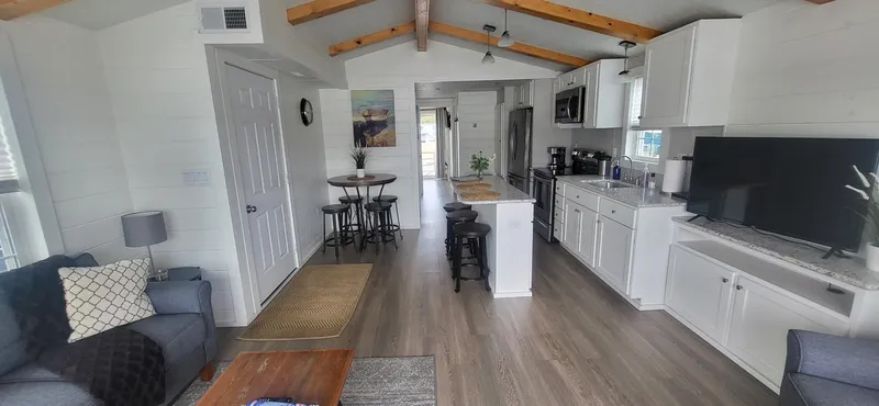  Yacht Photos Pics Modern interior of 2020 Destination Yachts 16x45 Condo Series with open kitchen and living area.