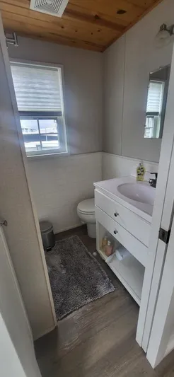  Yacht Photos Pics Bathroom in 2020 Destination Yachts 16x45 Condo Series, featuring modern fixtures and wood ceiling.