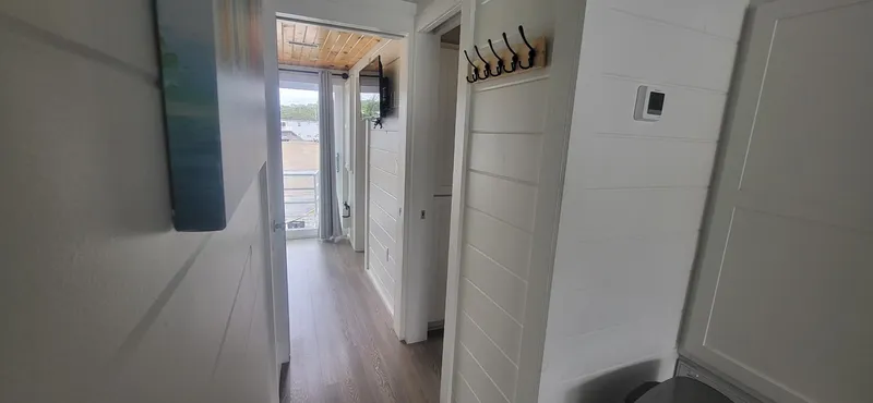  Yacht Photos Pics Interior hallway of 2020 Destination Yachts 16x45 Condo Series, featuring modern design and wood flooring.