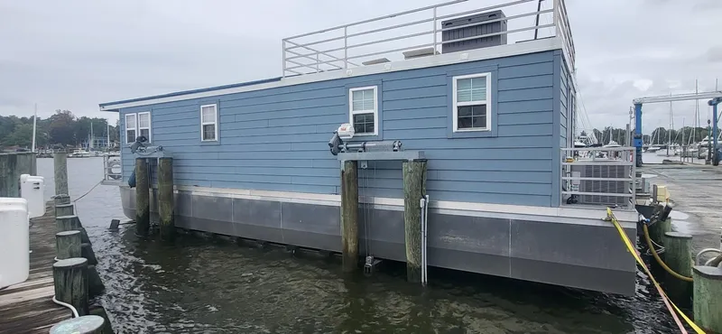  Yacht Photos Pics 2020 Destination Yachts 16x45 Condo Series houseboat docked at marina.