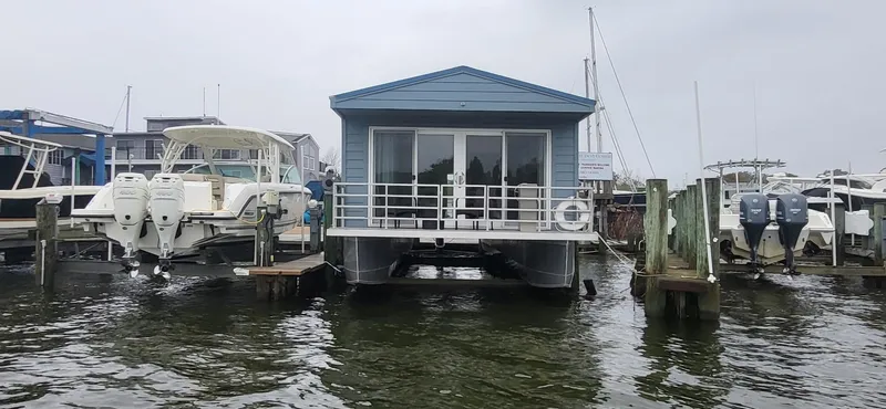  Yacht Photos Pics 2020 Destination Yachts 16x45 Condo Series houseboat docked at marina.